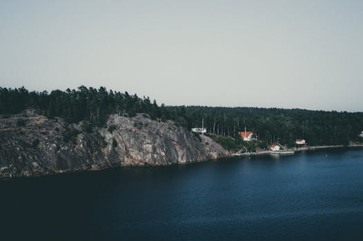pexels-photo-1694867-1694867 Picturesque aerial view of the coastal landscape in Stockholms län, featuring cliffs and serene waters.
